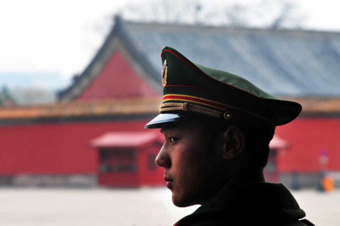 Beijing,-,Mar,11,2009:suspicious,Chinese,Soldier,Guards,At,Tienanmen