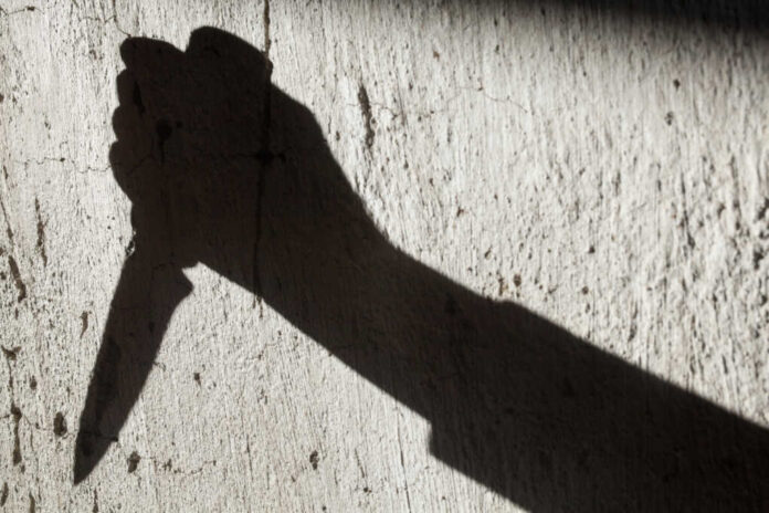 Shadow,Of,The,Hand,Holding,A,Big,Sharp,Knife.,Murderer,