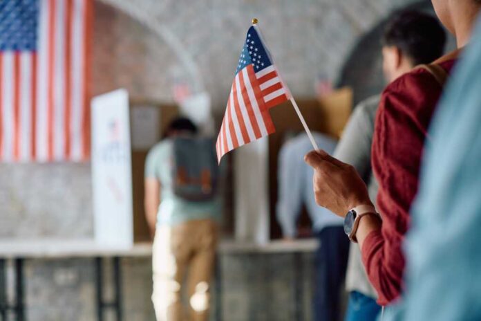Close,Up,Of,African,American,Voter,With,National,Flag,In
