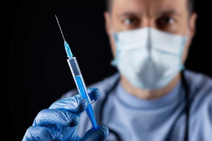 Doctor,,Or,Scientist,Hand,In,Blue,Nitrile,Gloves,Holding,Flu,