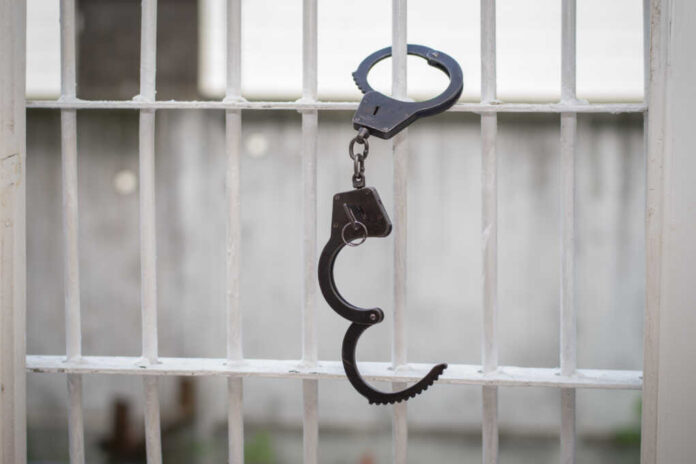 Open,Handcuffs,Hang,On,The,Cage.,Successful,Escape,Exemption