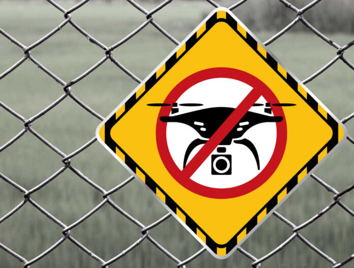 No,Drone,Zone,Warning,Sign,At,Fence,Wall,,Prohibition,Sign