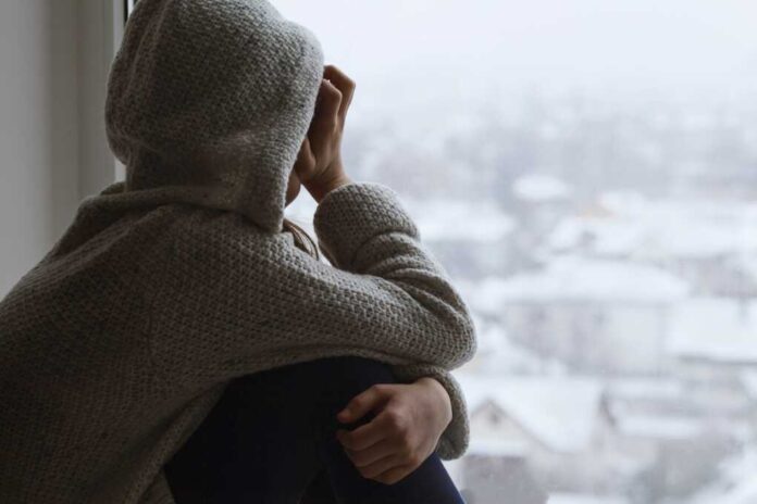 Depressed,Upset,Sad,Teen,Girl,Looks,Out,The,Window,Back