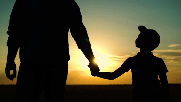 Little,Son,,Dad,Hold,Hands,Close,Up,In,Nature,In