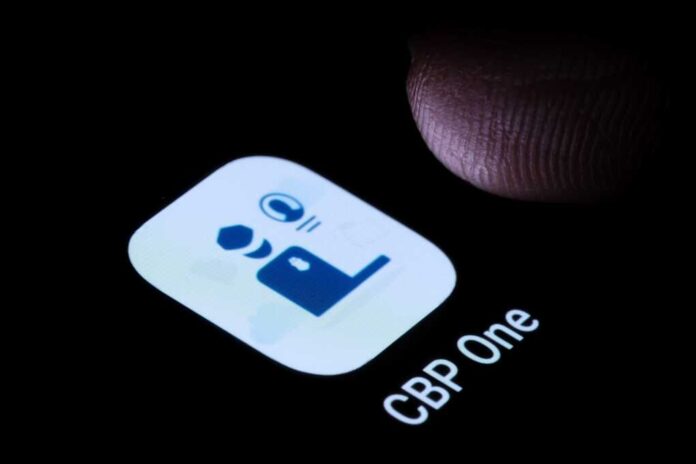 Cbp,One,App,Seen,On,Smartphone,Screen,And,Finger,Above