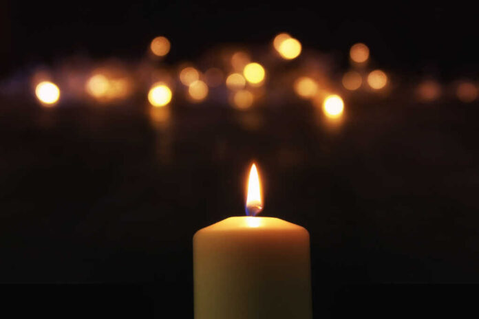Burning,Candles,Over,Black,Background,With,Bokeh,Glitter,Lights.