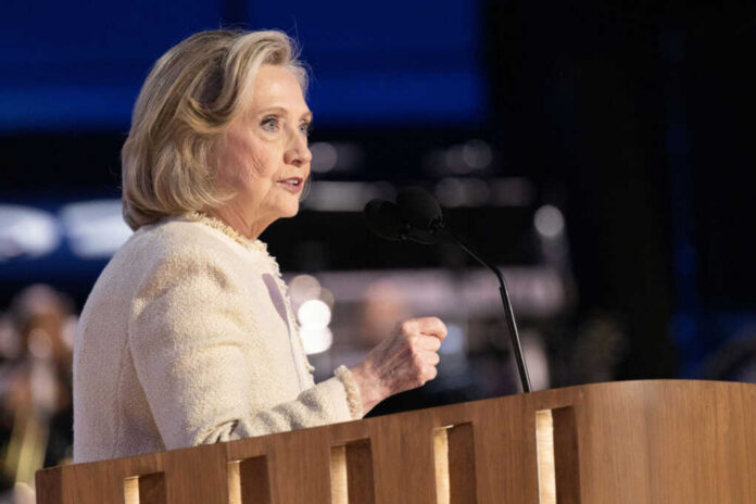 A woman speaking at a podium with a microphone during a public event
