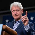 Former president gesturing while speaking at an event