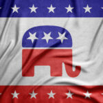 A textured fabric featuring the Republican Party elephant logo in red, surrounded by stars and stripes in blue and white