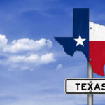 Texas state outline with flag colors and a road sign indicating Texas