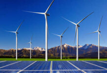 Wind turbines and solar panels in a scenic landscape