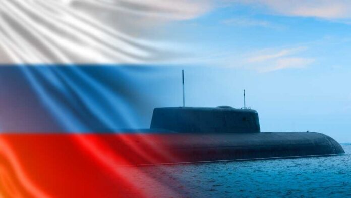 A submarine partially submerged in water with the Russian flag in the background