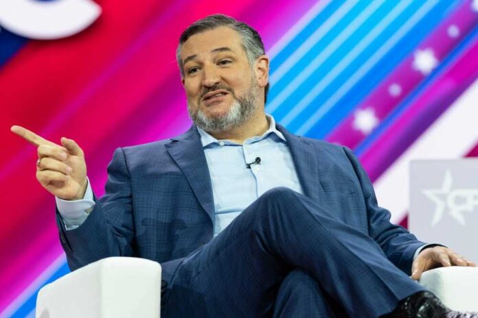 A man in a suit speaking at a conference