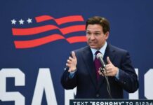 A politician delivering a speech at a podium with a microphone