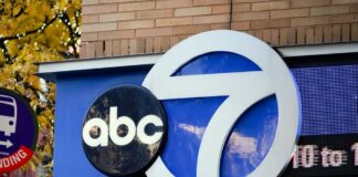 Logo of a news station displayed on a building