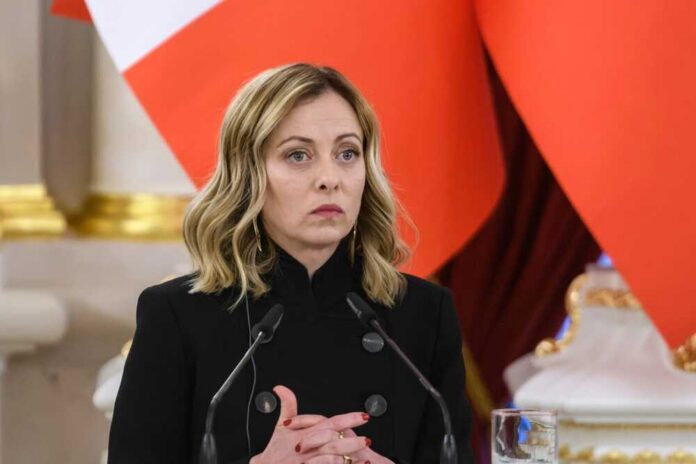 A political leader at a press conference with a serious expression