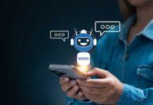 Person holding a smartphone with a chatbot interface displayed