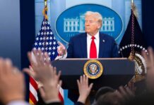 A political leader addressing the media at a press conference