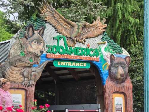 Entrance to ZooAmerica featuring animal sculptures and signage