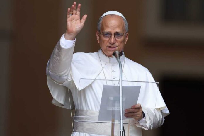 Religious leader giving a speech outdoors with a raised hand