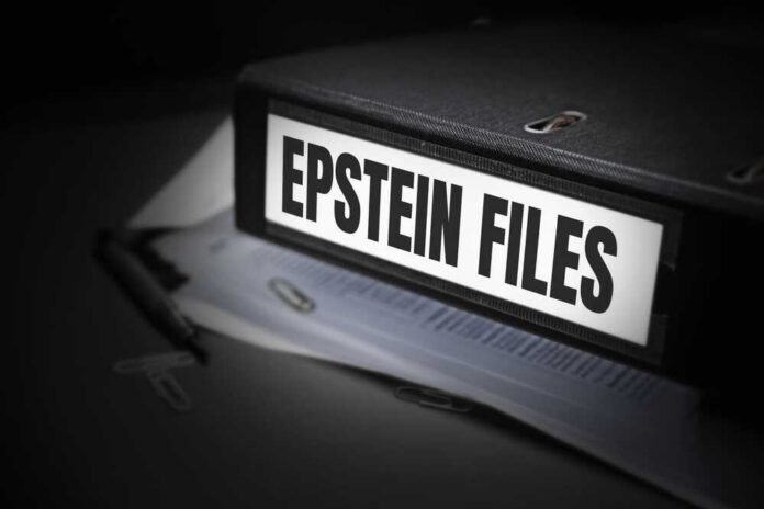 A black binder labeled 'Epstein Files' with papers and a pen beside it