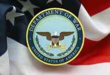 Pentagon Turmoil: Leadership Rift Exposed! Emblem of the Department of War on a background of the American flag
