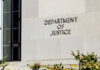 DOJ’s SHOCKING Move Against Anti-ICE Violence Sign on the exterior wall of the Department of Justice building