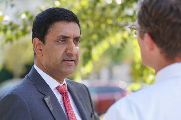 Two professionals engaged in a conversation outdoors