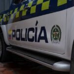 Close-up of a Colombian police vehicle with the word 'POLICÍA' visible