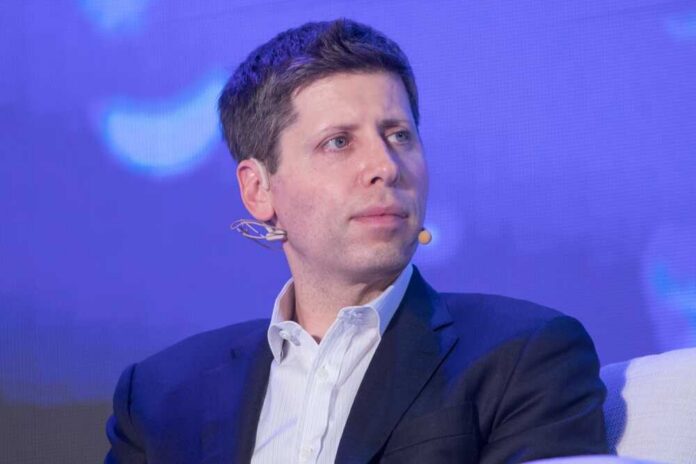 A man in a suit speaking at a conference with a microphone