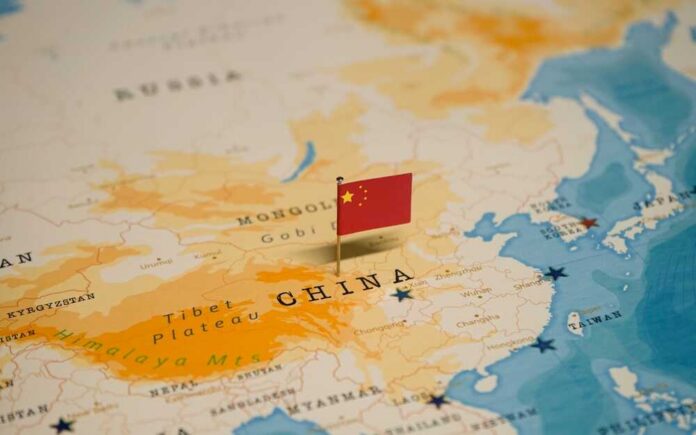 Map of China with a small Chinese flag placed on it