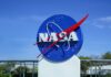 Mars ‘Slingshot’ Boosts NASA’s Bold Mission NASA logo displayed against a clear blue sky