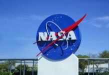 Mars ‘Slingshot’ Boosts NASA’s Bold Mission NASA logo displayed against a clear blue sky