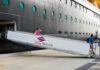 Passengers boarding a Disney cruise ship via a ramp