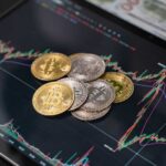 Various cryptocurrency coins on a digital trading chart