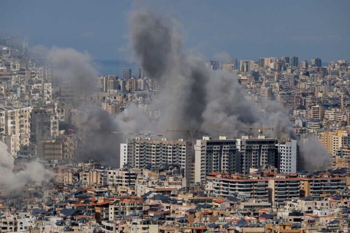Smoke rising from buildings in a densely populated urban area