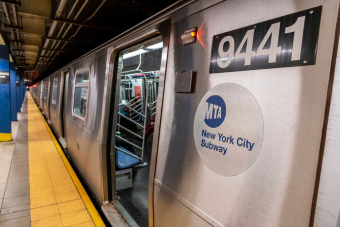shutterstock2164393049jpg New York City subway train at a station with open doors
