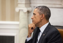 Obama, Ukraine, And The Missing Answers A political figure in a formal setting, deep in thought