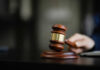 Capital Punishment Back In The Capital? A wooden gavel resting on a desk, symbolizing justice and legal proceedings