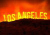 Outrage Erupts: Did LA Let Homes Burn? A dramatic landscape featuring the words Los Angeles against an orange sky, suggesting a fire or sunset.