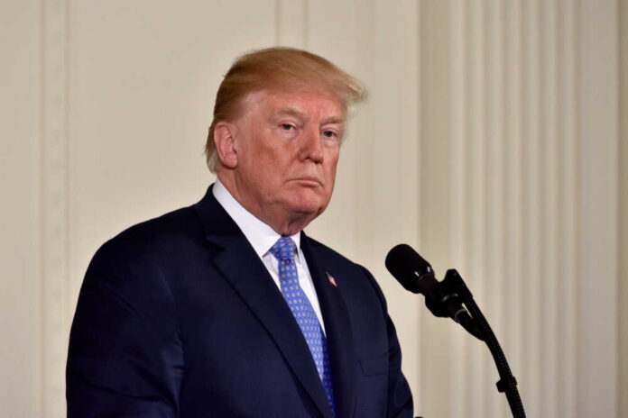 Washington,,Dc,-,April,27,,2018:,President,Donald,Trump,Pauses A political figure standing at a microphone with a serious expression