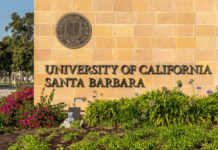Elite Campus, Alleged Rapist Vanishes University entrance sign with seal and landscaping