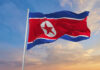 North Korea Turns Naval Failure Into Warning North Korean flag waving against a blue sky