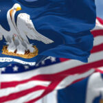 Incumbent Ousted: Chaos Rocks GOP Close-up of the Louisiana state flag with an American flag in the background