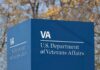 Trusted Aide Loots Vet—Spin Machine Whirs Sign for the U.S. Department of Veterans Affairs