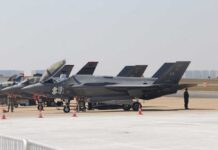 NATO Could Lose Key U.S. Forces F-35 military jets parked on an airfield with crew members nearby