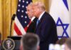 Fury Call: Trump Torches Netanyahu Donald Trump and another official at a press conference with flags in the background