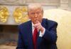 U.S. Strikes Iran After Strait Drone Attack A man in a blue suit and red tie pointing while seated