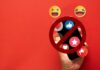 Ban Blitz: London Targets Kids’ Screens A hand holding a smartphone with social media icons and a prohibition sign