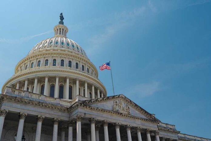 Us,Congress,,Capitol.,Washington,Dc,Skyline,Featuring,The,Capitol.,Senate The U.S. Capitol building with an American flag flying against a blue sky